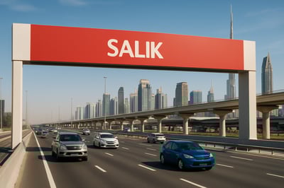 Dubai toll road with Salik gate and vehicles passing Dubai toll road with Salik gate and vehicles passing